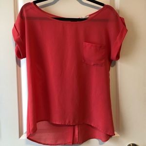 pink blouse with buttons down the back